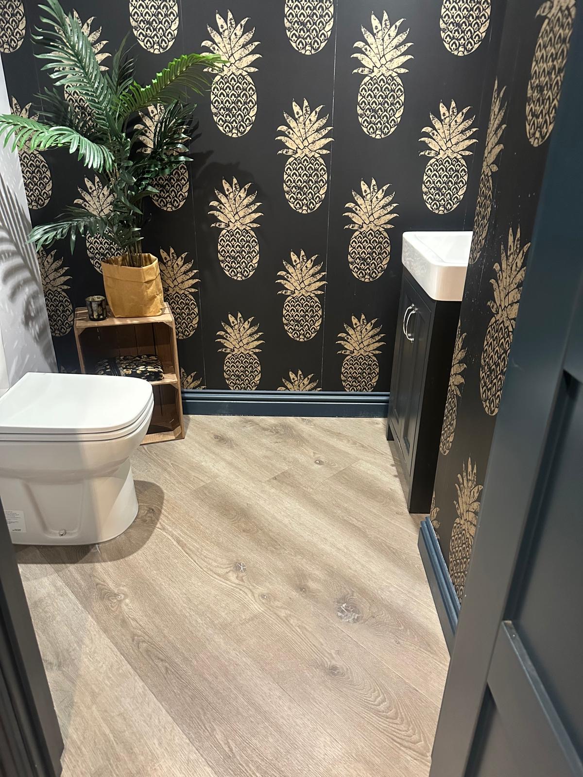Wood-effect LVT flooring fitted in the Guildford basement toilet