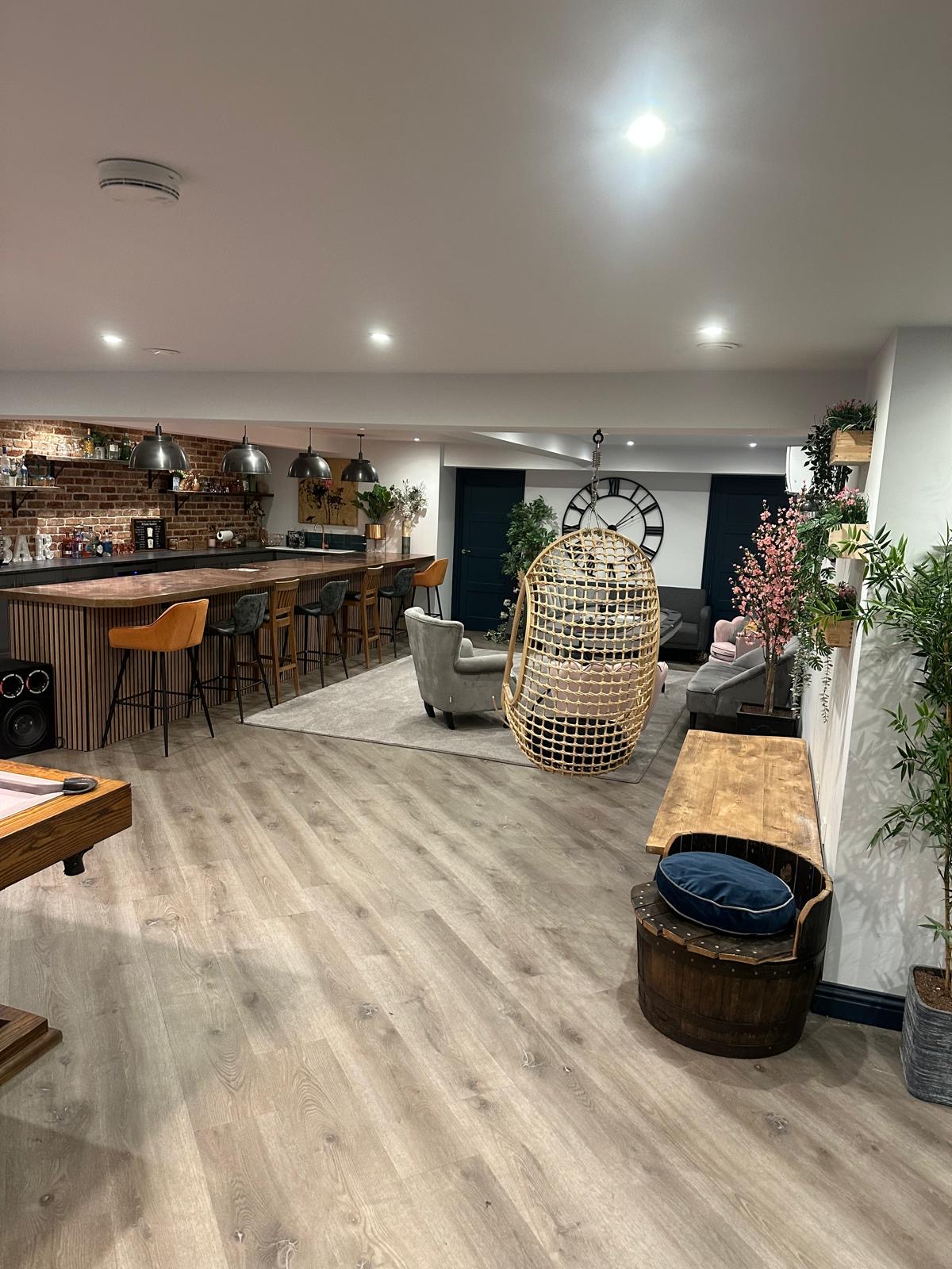 Completed Guildford basement with LVT, private bar and made-to-measure carpet rug