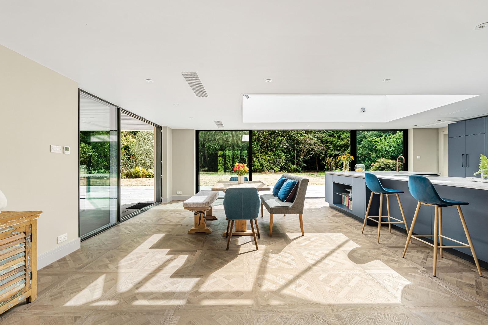 Sunlight revealing the detailed Versailles pattern across the Dorking kitchen floor
